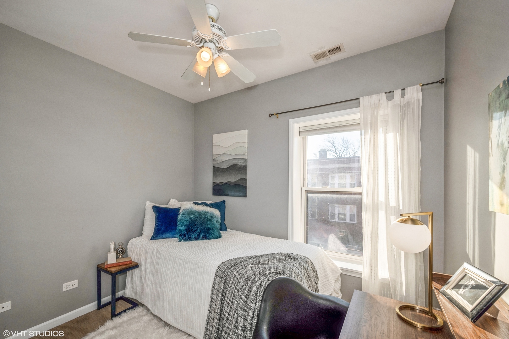 1750 West Rascher Avenue, Unit 2 Chicago, IL 60640 - Photo 8 of 11 a bedroom with a bed and a table