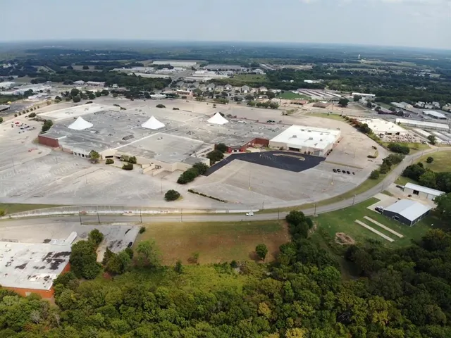 an aerial view of a house with outdoor space