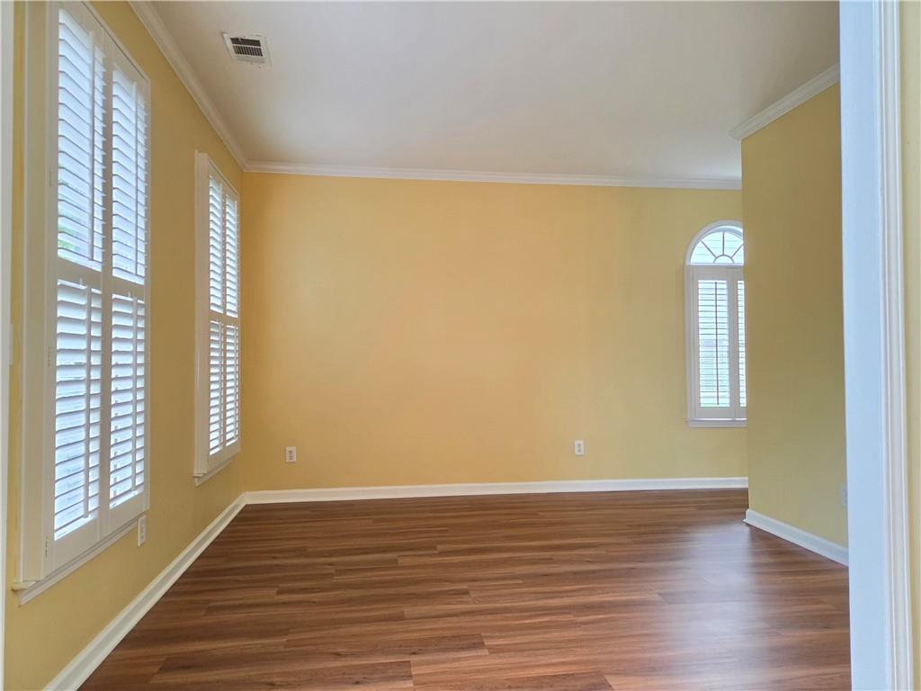 3715 Ridgeside Court Suwanee, GA 30024 - Photo 4 of 44 a view of empty room with wooden floor and fan