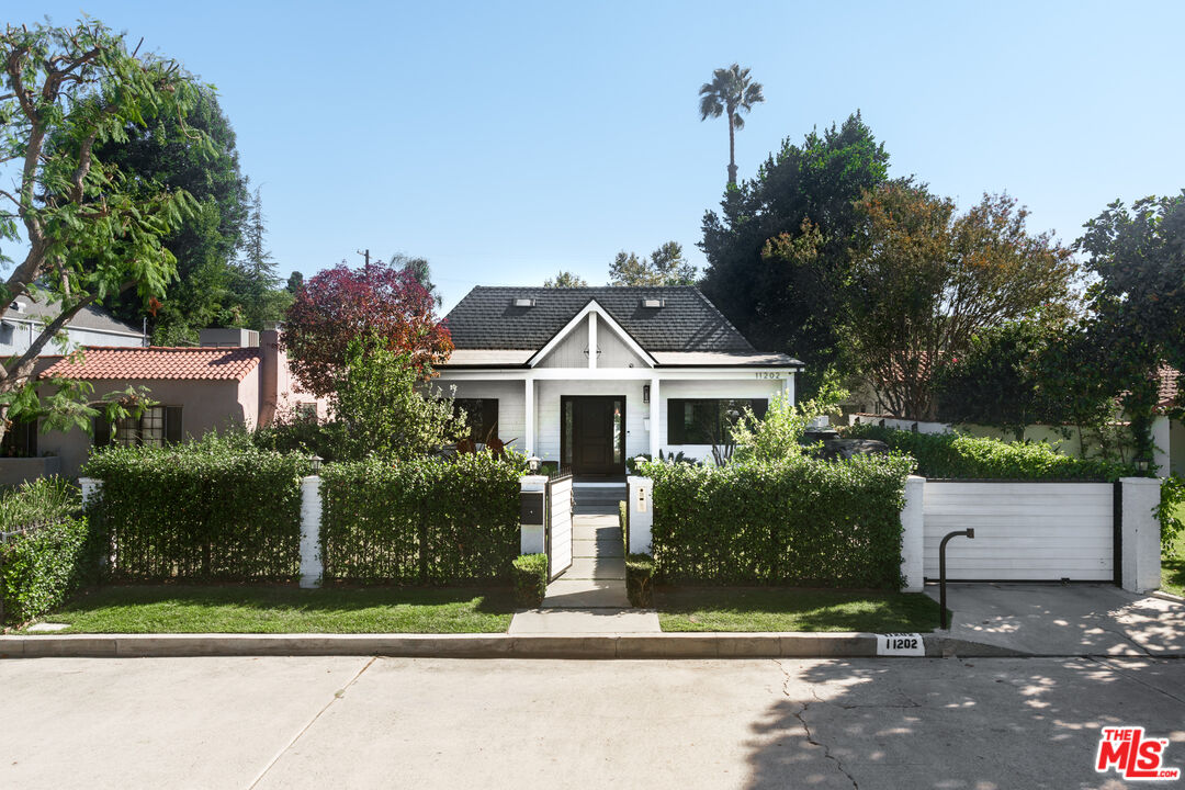 11202 Kling Street North Hollywood, CA 91602 - Photo 1 of 18 a front view of a house with a yard