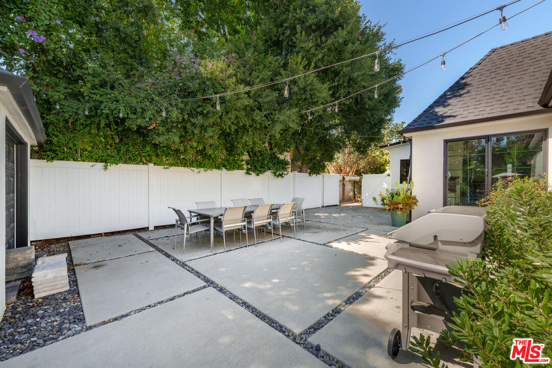 11202 Kling Street North Hollywood, CA 91602 - Photo 16 of 18 a view of a patio with table and chairs and potted plants