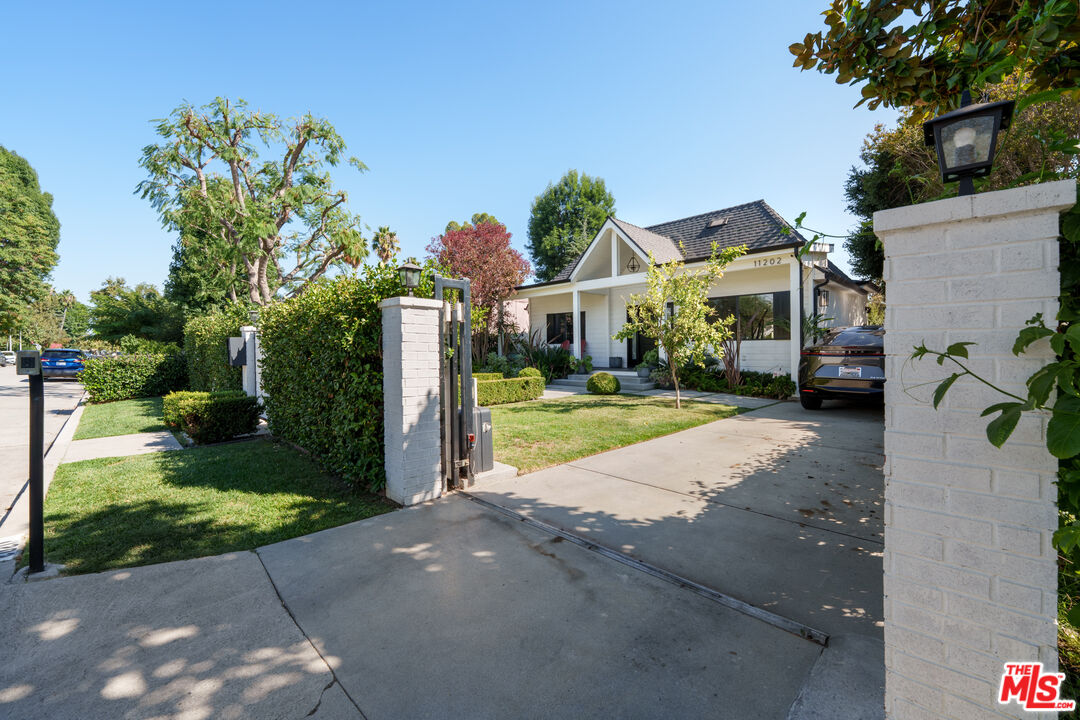 11202 Kling Street North Hollywood, CA 91602 - Photo 2 of 18 a view of street along with house and trees