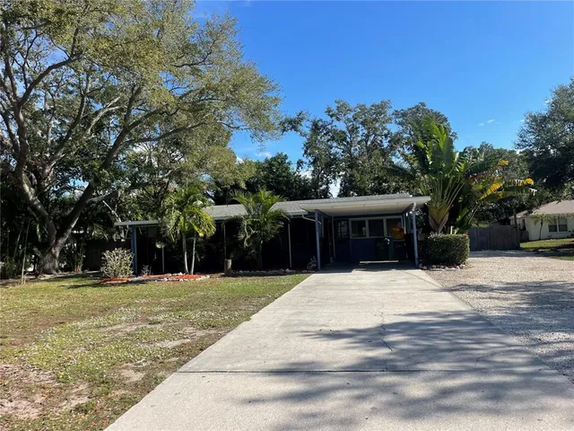 a swimming pool with trees in front of it