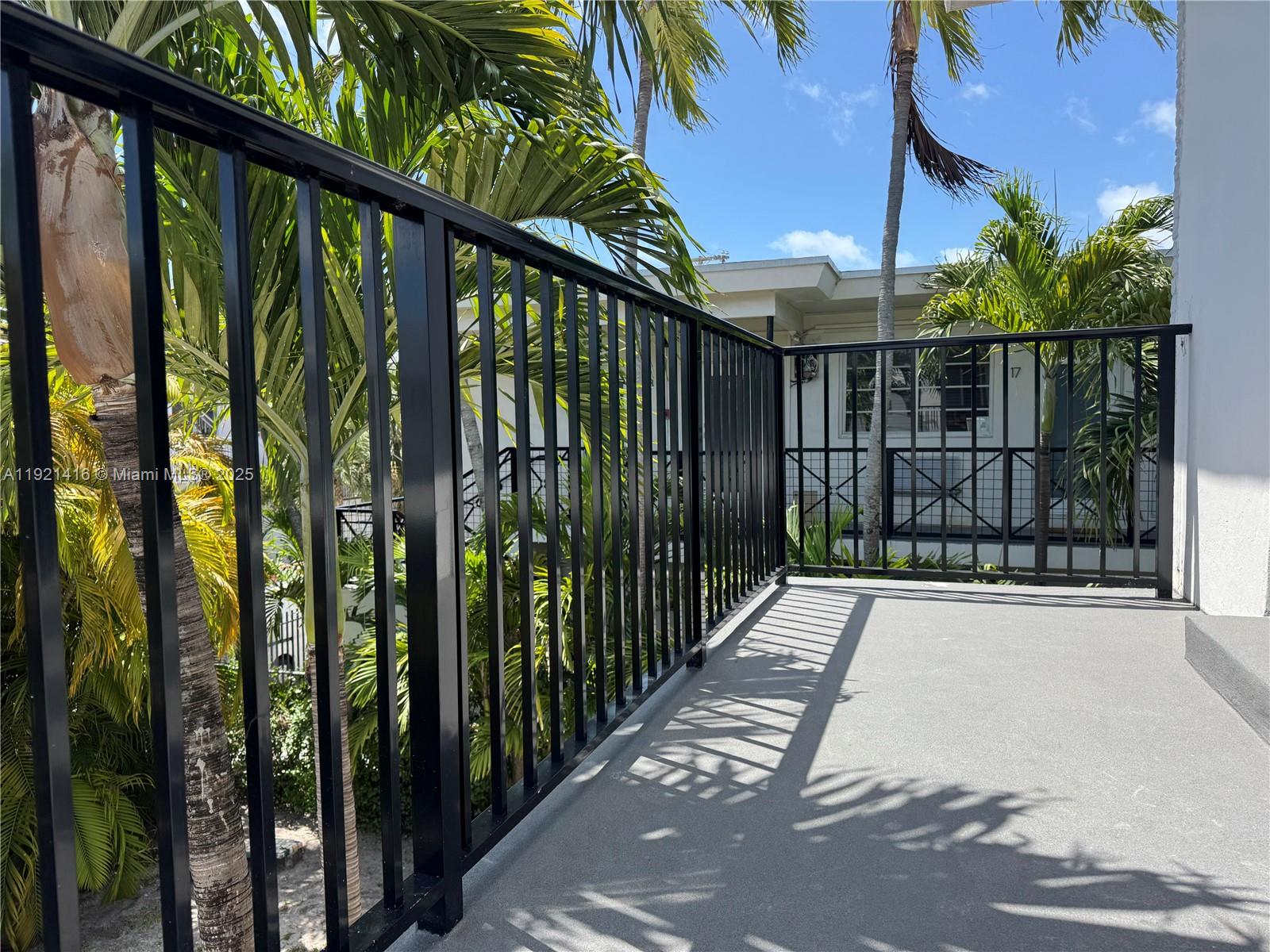 7325 Byron Avenue, Unit 8 Miami Beach, FL 33141 - Photo 4 of 16 a view of balcony with staircase