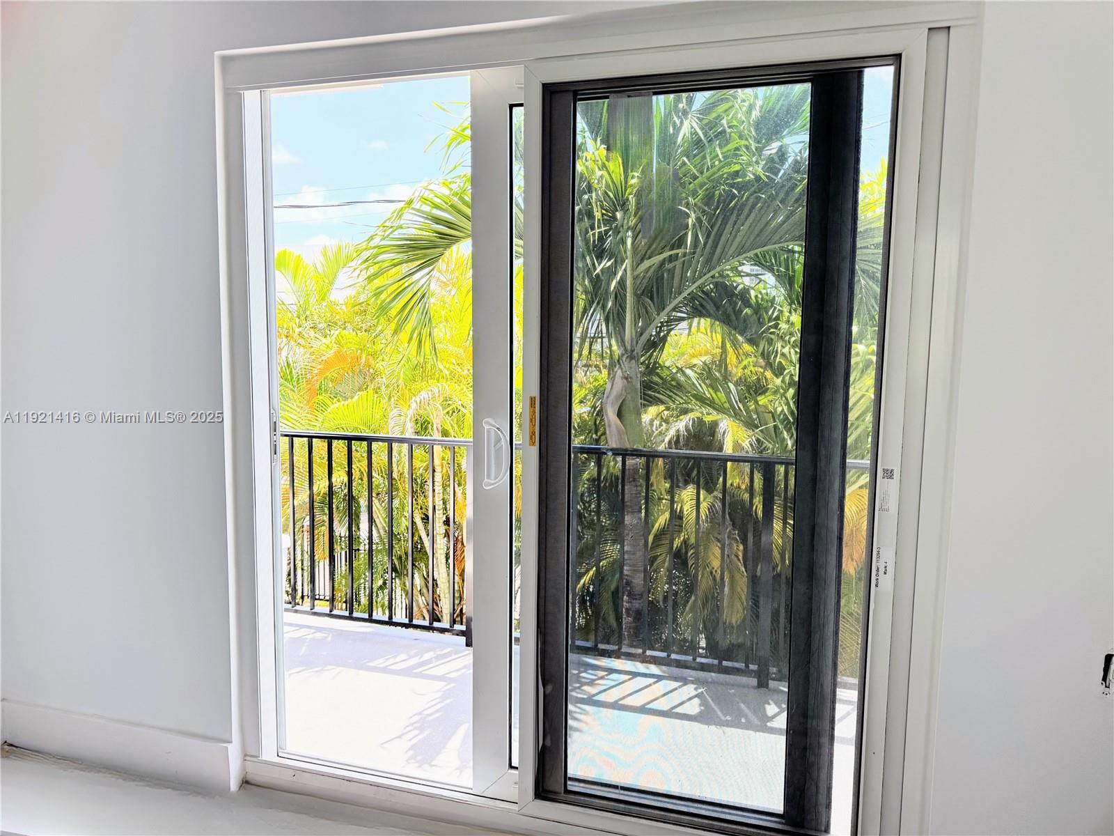 7325 Byron Avenue, Unit 8 Miami Beach, FL 33141 - Photo 5 of 16 a view of a room with a large window