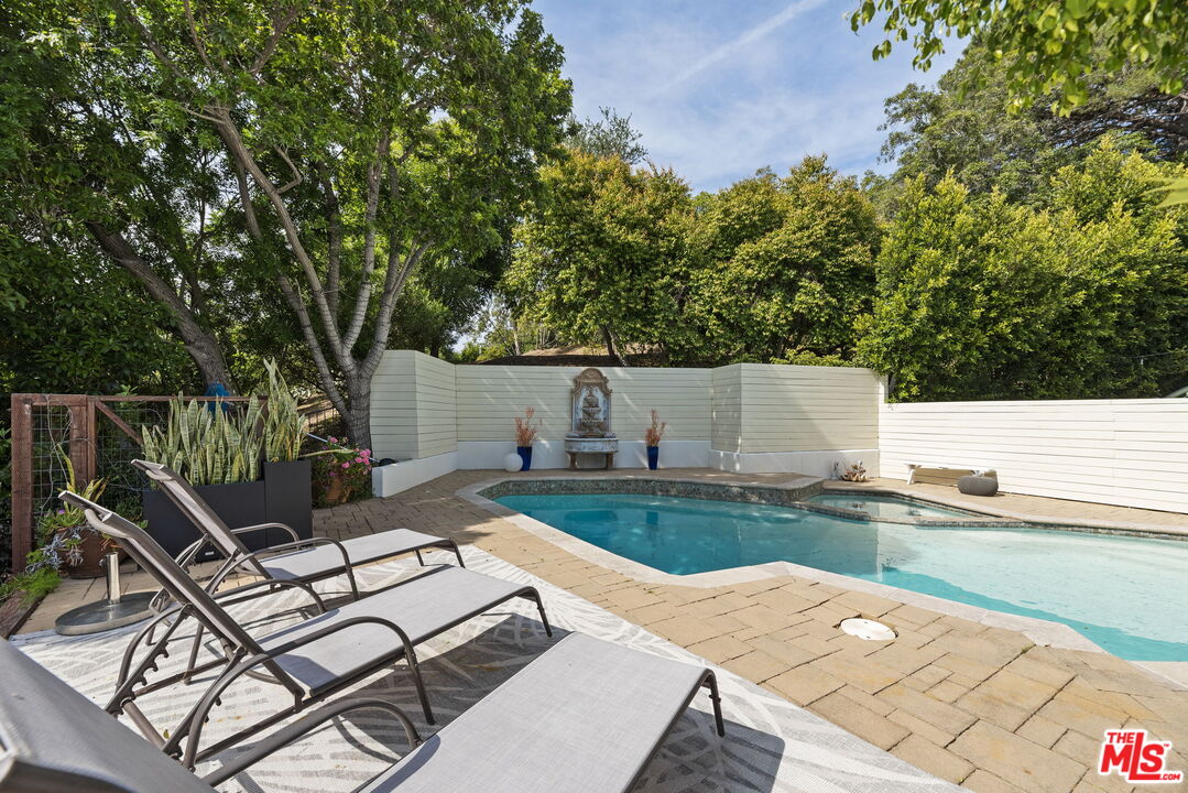 641 Walther Way Los Angeles, CA 90049 - Photo 40 of 53 a view of backyard of house with seating space