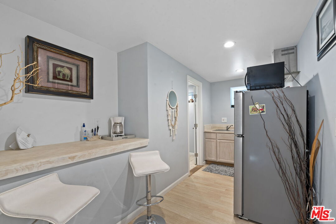 641 Walther Way Los Angeles, CA 90049 - Photo 46 of 53 a bathroom with a sink toilet and a mirror