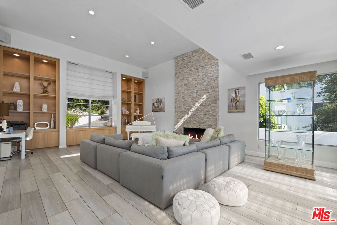 641 Walther Way Los Angeles, CA 90049 - Photo 9 of 53 a living room with furniture and a large window