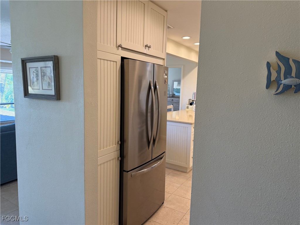 5117 Sea Bell Road, Unit G205 Sanibel, FL 33957 - Photo 12 of 31 a metallic refrigerator freezer sitting in a kitchen