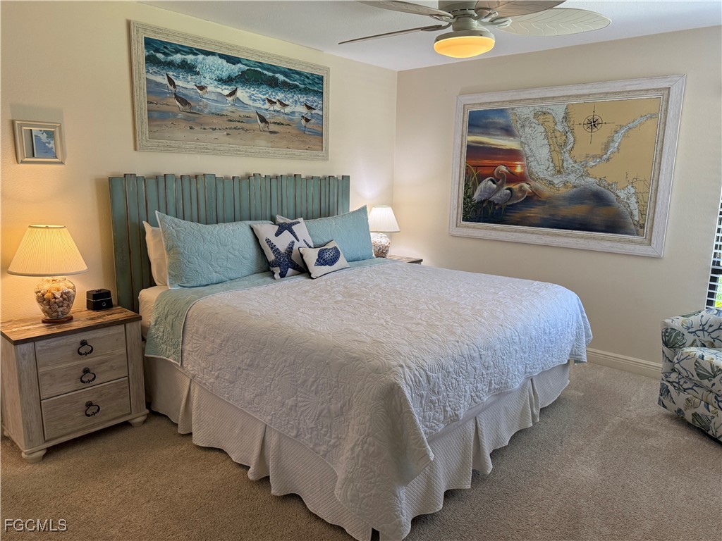 5117 Sea Bell Road, Unit G205 Sanibel, FL 33957 - Photo 14 of 31 a bedroom with bed and wall painting on the wall