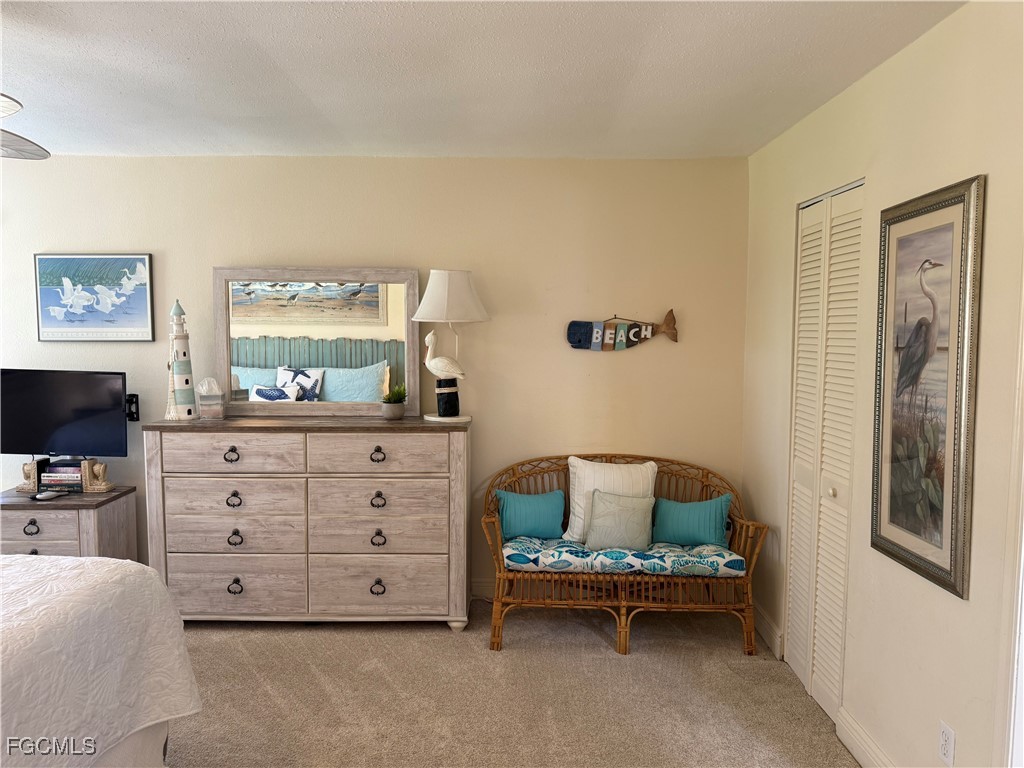 5117 Sea Bell Road, Unit G205 Sanibel, FL 33957 - Photo 15 of 31 a living room with furniture and a flat screen tv
