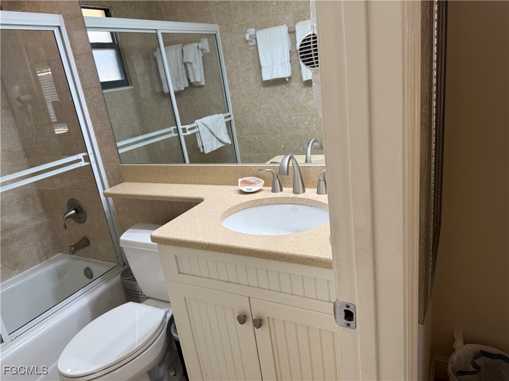 5117 Sea Bell Road, Unit G205 Sanibel, FL 33957 - Photo 17 of 31 a bathroom with a sink toilet and shower