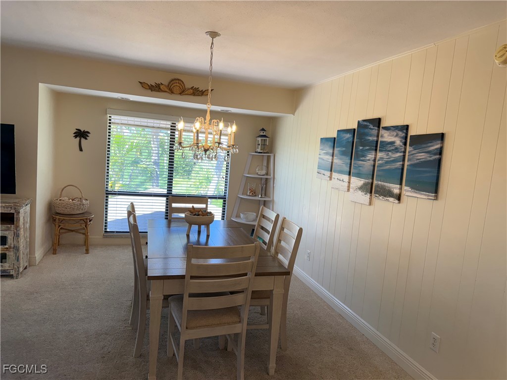 5117 Sea Bell Road, Unit G205 Sanibel, FL 33957 - Photo 8 of 31 a view of a dining room with furniture window and outside view