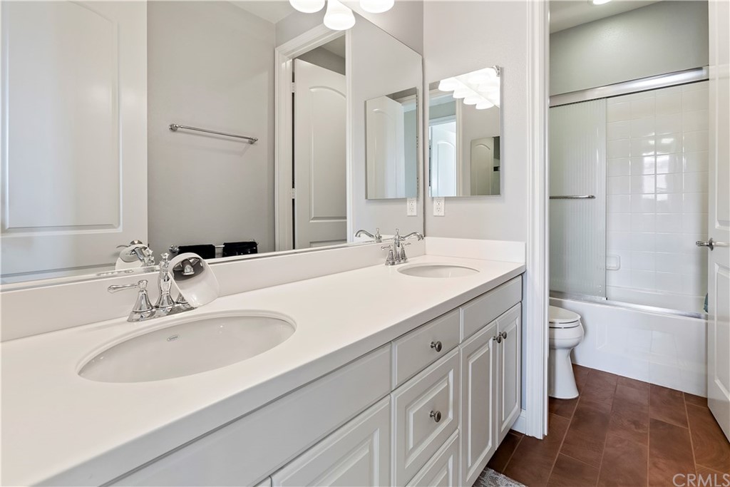 95 Shadowbrook Irvine, CA 92604 - Photo 10 of 23 a bathroom with a double vanity sink mirror double and a bathtub