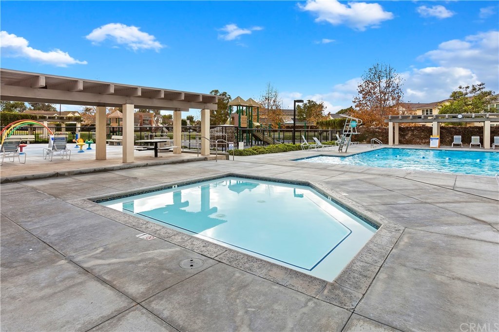 95 Shadowbrook Irvine, CA 92604 - Photo 18 of 23 a view of a swimming pool with a lounge chair