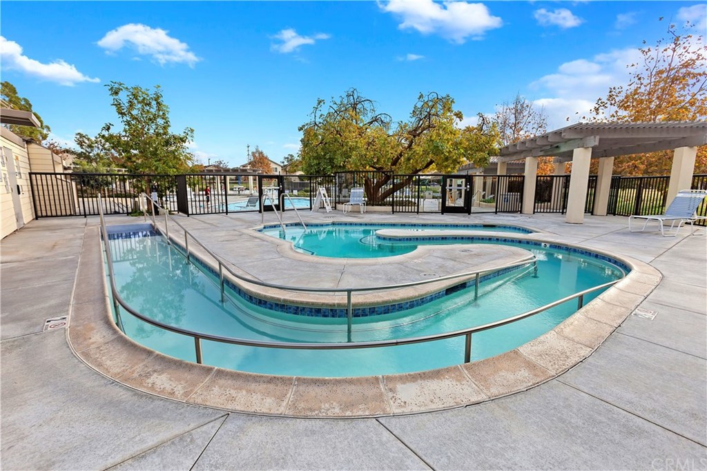 95 Shadowbrook Irvine, CA 92604 - Photo 19 of 23 a view of a swimming pool with outdoor seating and plants