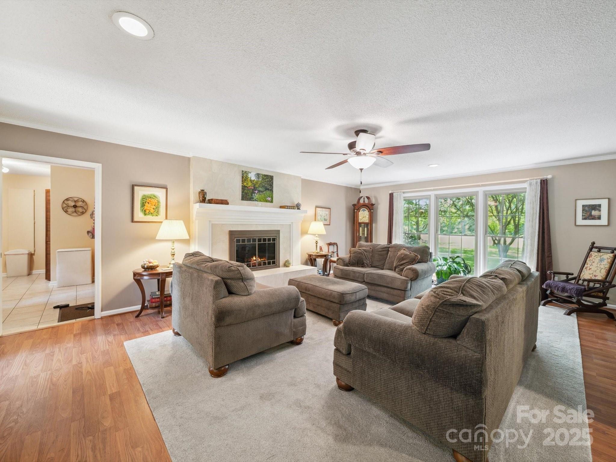 394 Gold Mine Road Wadesboro, NC 28170 - Photo 13 of 39 a living room with furniture and a fireplace