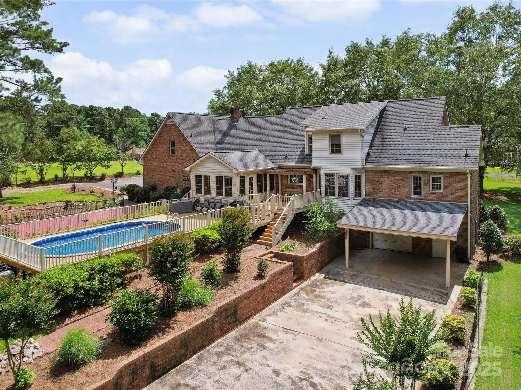 394 Gold Mine Road Wadesboro, NC 28170 - Photo 2 of 39 an aerial view of a house with a garden and a yard