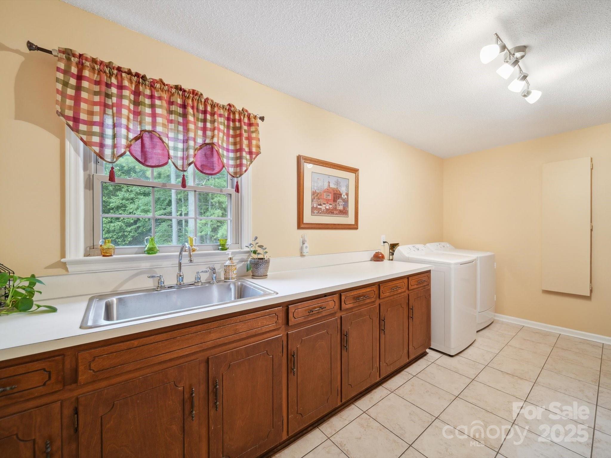 394 Gold Mine Road Wadesboro, NC 28170 - Photo 23 of 39 a spacious bathroom with a double vanity sink mirror and window