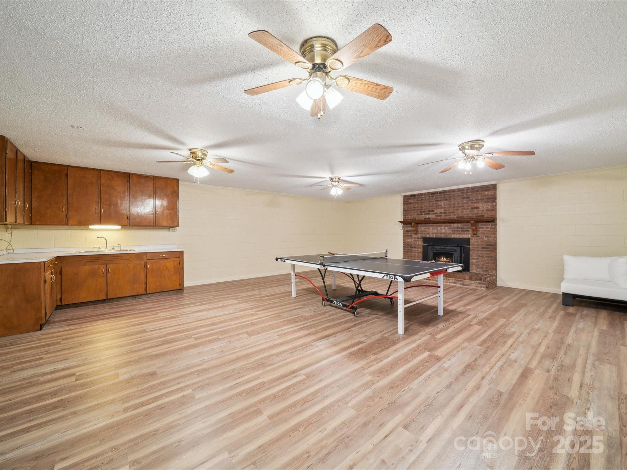 394 Gold Mine Road Wadesboro, NC 28170 - Photo 28 of 39 a living room with furniture and a fireplace