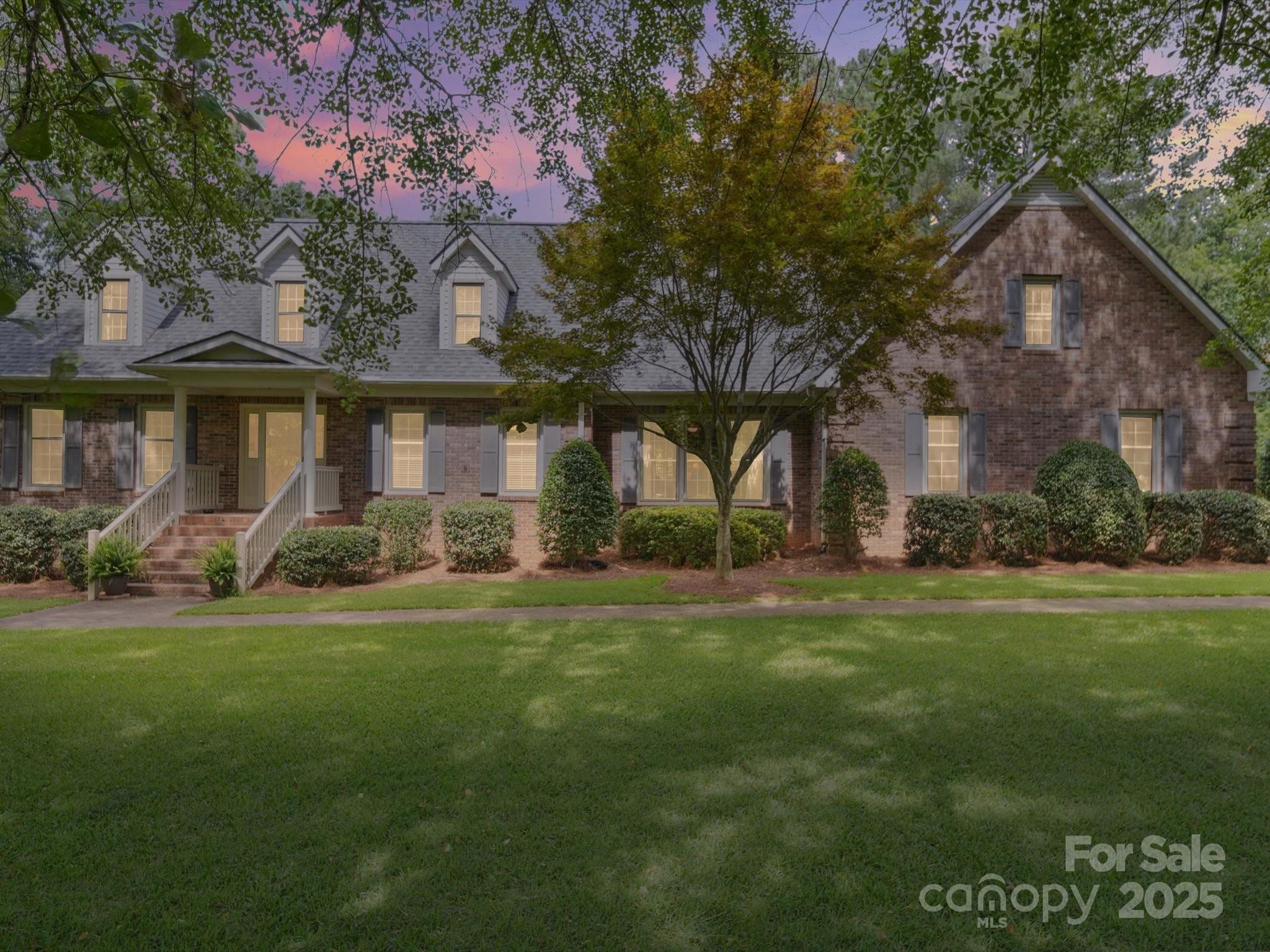 394 Gold Mine Road Wadesboro, NC 28170 - Photo 36 of 39 a front view of a house with a garden
