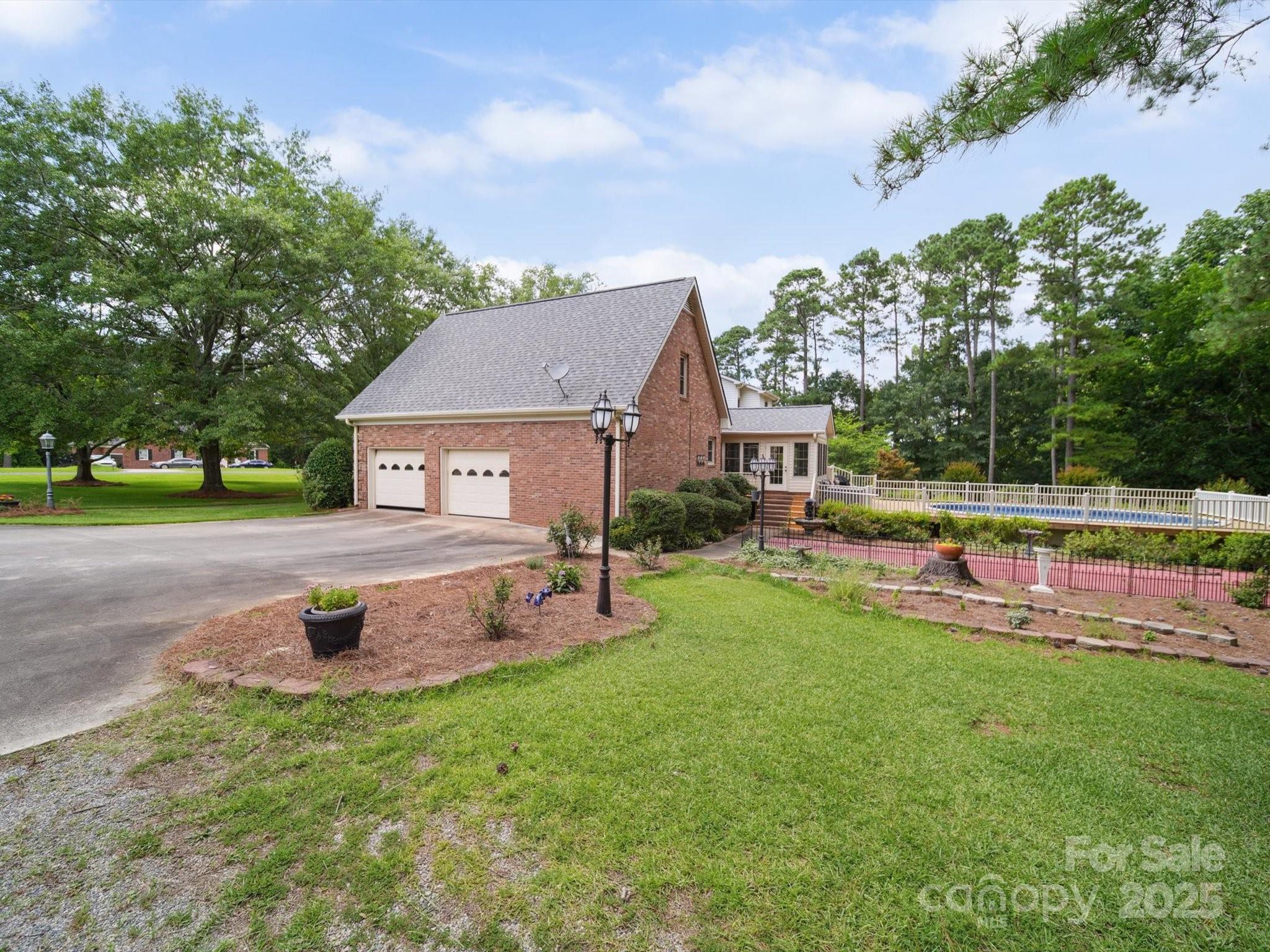 394 Gold Mine Road Wadesboro, NC 28170 - Photo 5 of 39 a view of a house with a yard porch and sitting area