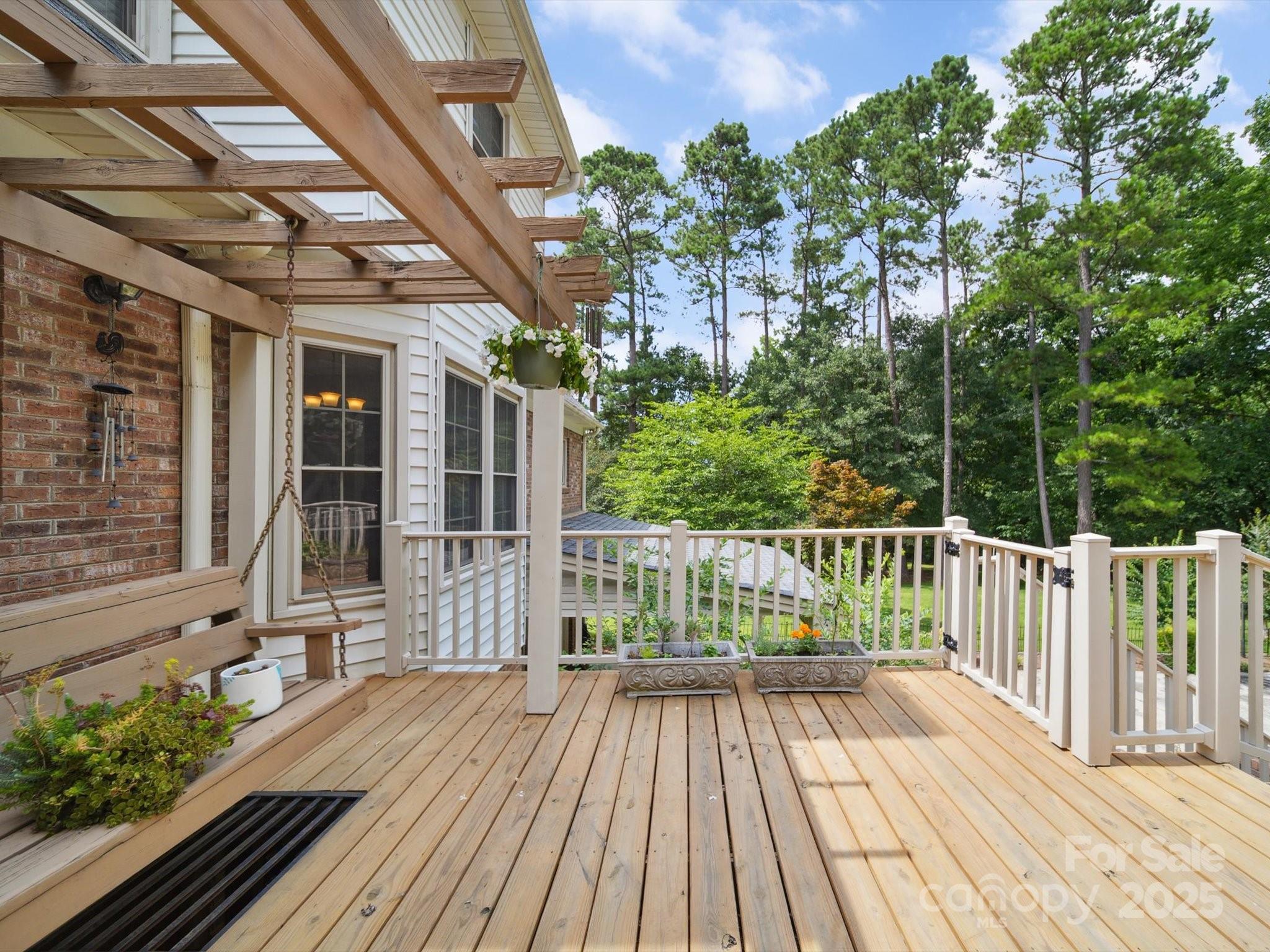 394 Gold Mine Road Wadesboro, NC 28170 - Photo 7 of 39 a view of balcony with wooden floor and fence and a potted plant