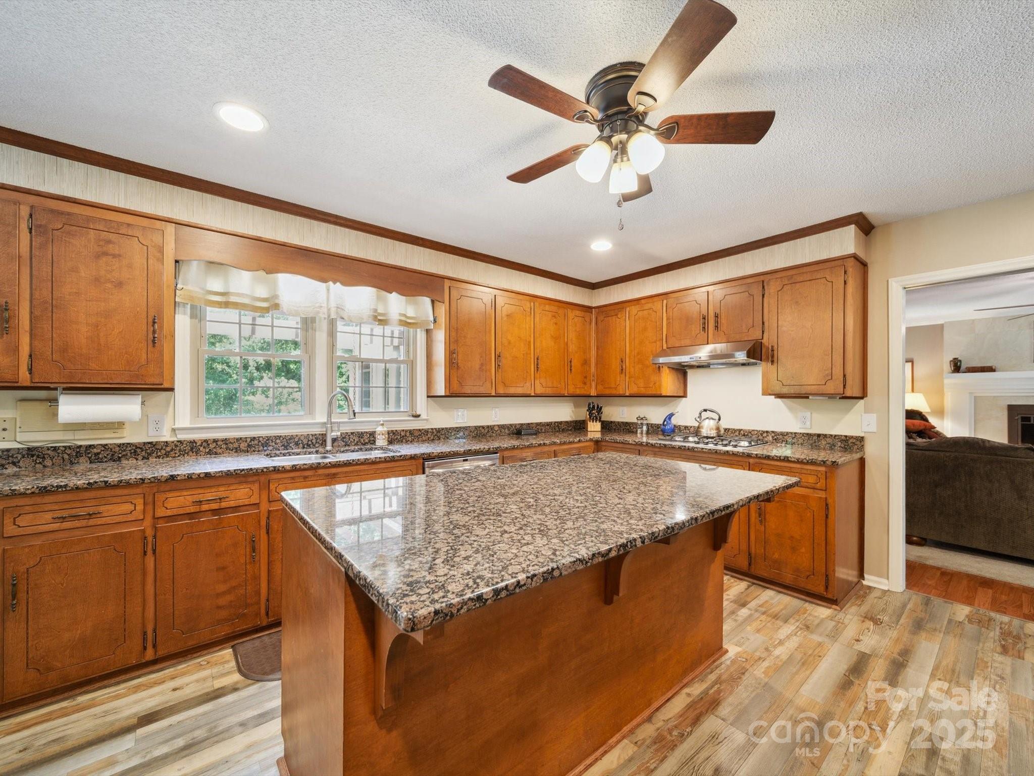 394 Gold Mine Road Wadesboro, NC 28170 - Photo 8 of 39 a kitchen with stainless steel appliances granite countertop sink stove and refrigerator