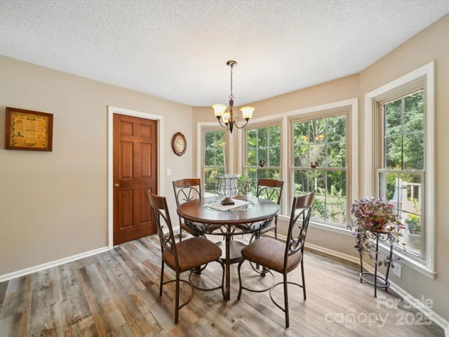 a dining room with furniture window garden view