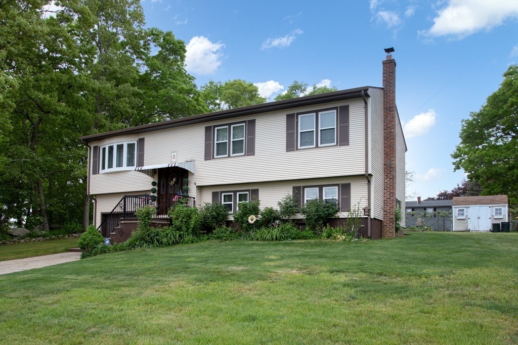 166 Stonehaven Road Fall River, MA 02723 - Photo 2 of 33 a front view of a house with garden