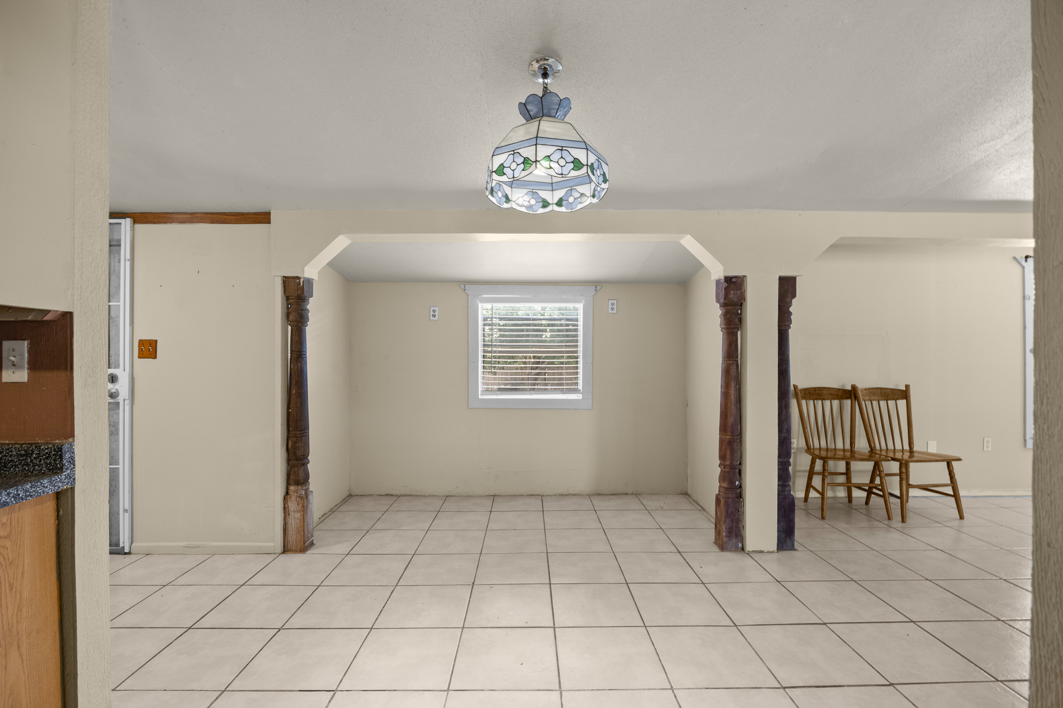 147 Community Center Road Rosanky, TX 78953 - Photo 9 of 33 Unfurnished dining area featuring light tile patterned floors and arched walkways