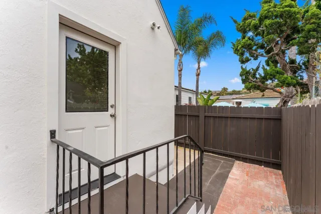 a view of balcony with a potted plant