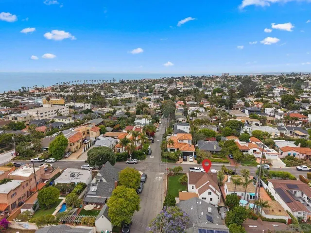 an aerial view of residential houses with outdoor space
