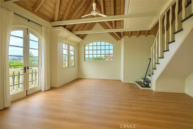 a view of an empty room with windows