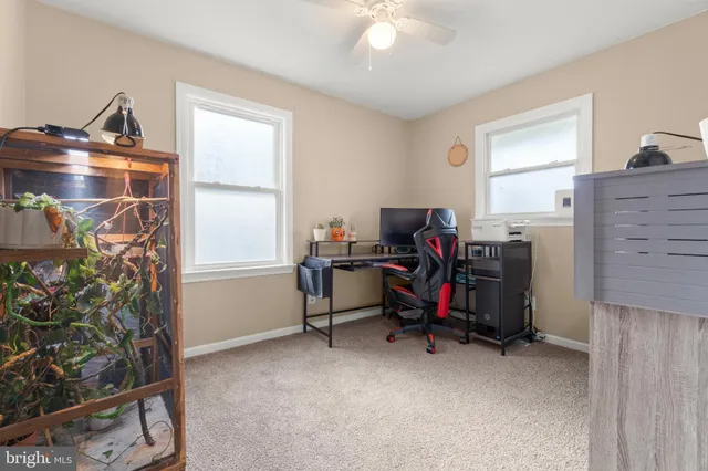 a view of a workspace with furniture