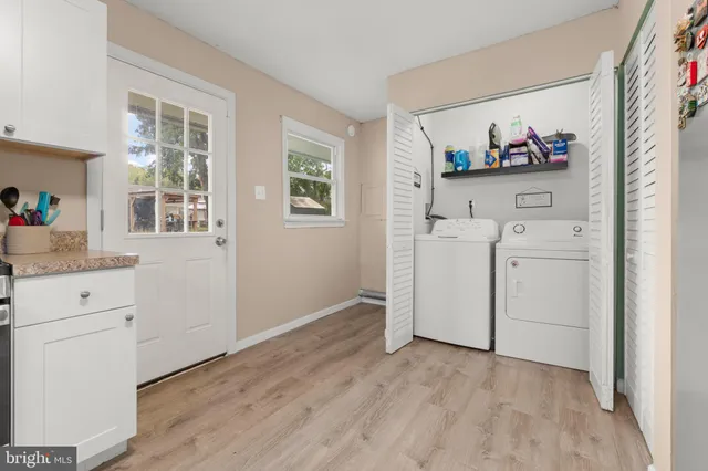 a view of a storage & utility room with washer and dryer