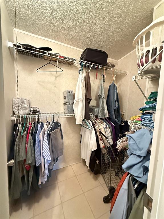 5109 Southwest 10th Street Bell, FL 32619 - Photo 30 of 38 a view of walk in closet with clothes and shoes