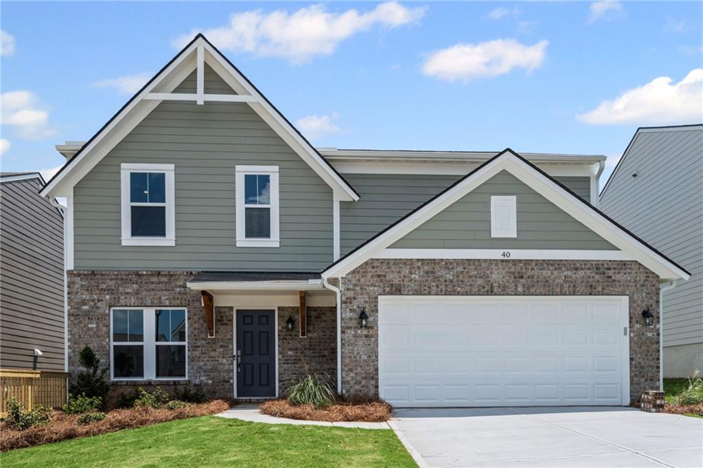 40 Cava Terrace Braselton, GA 30517 - Photo 1 of 1 a front view of a house with a yard and garage