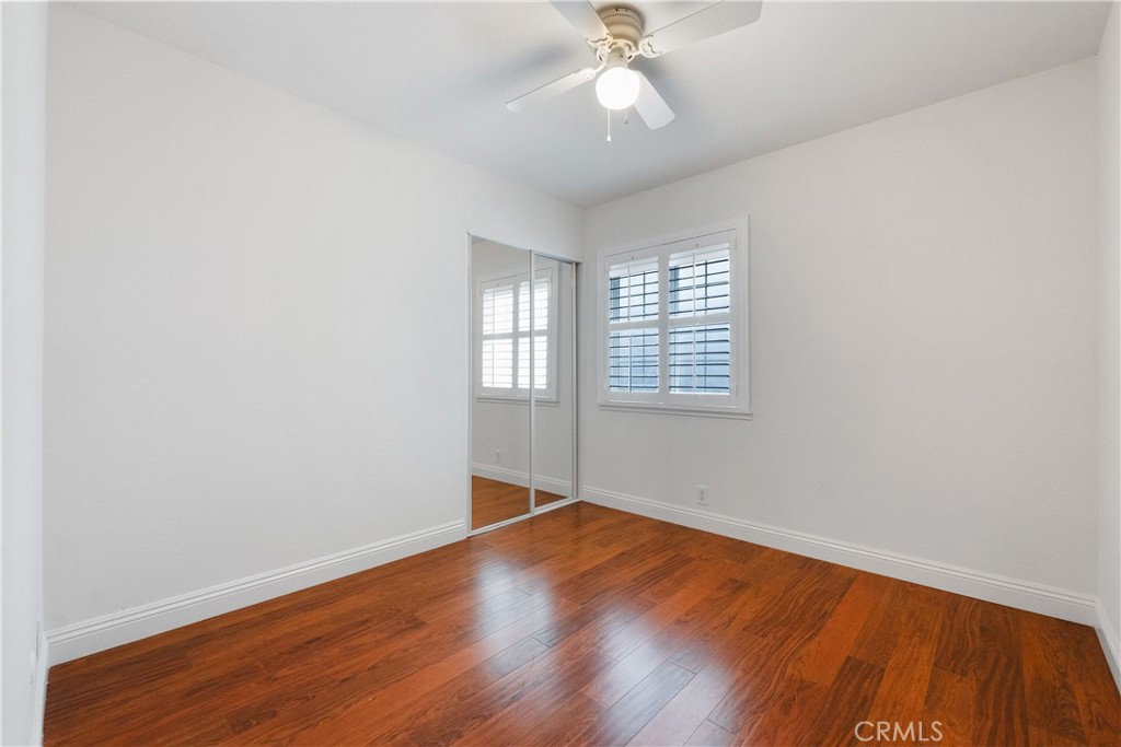 2172 Belhaven Avenue Simi Valley, CA 93063 - Photo 14 of 24 an empty room with wooden floor fan and windows