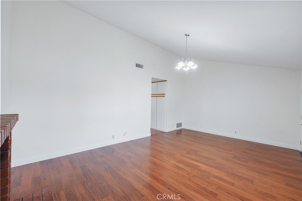 2172 Belhaven Avenue Simi Valley, CA 93063 - Photo 3 of 24 an empty room with wooden floor and windows