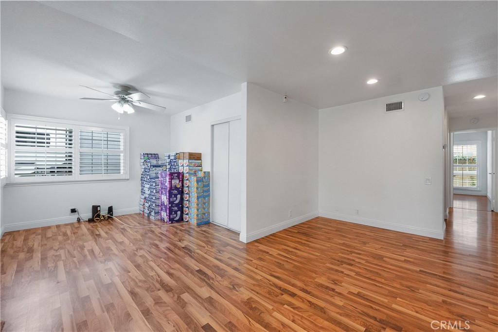 2172 Belhaven Avenue Simi Valley, CA 93063 - Photo 4 of 24 a view of a room with wooden floor and ceiling fan