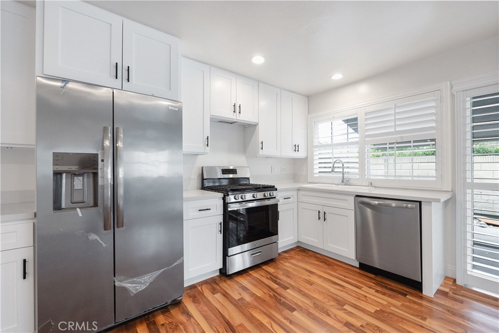 2172 Belhaven Avenue Simi Valley, CA 93063 - Photo 5 of 24 a kitchen with granite countertop stainless steel appliances a refrigerator sink and microwave