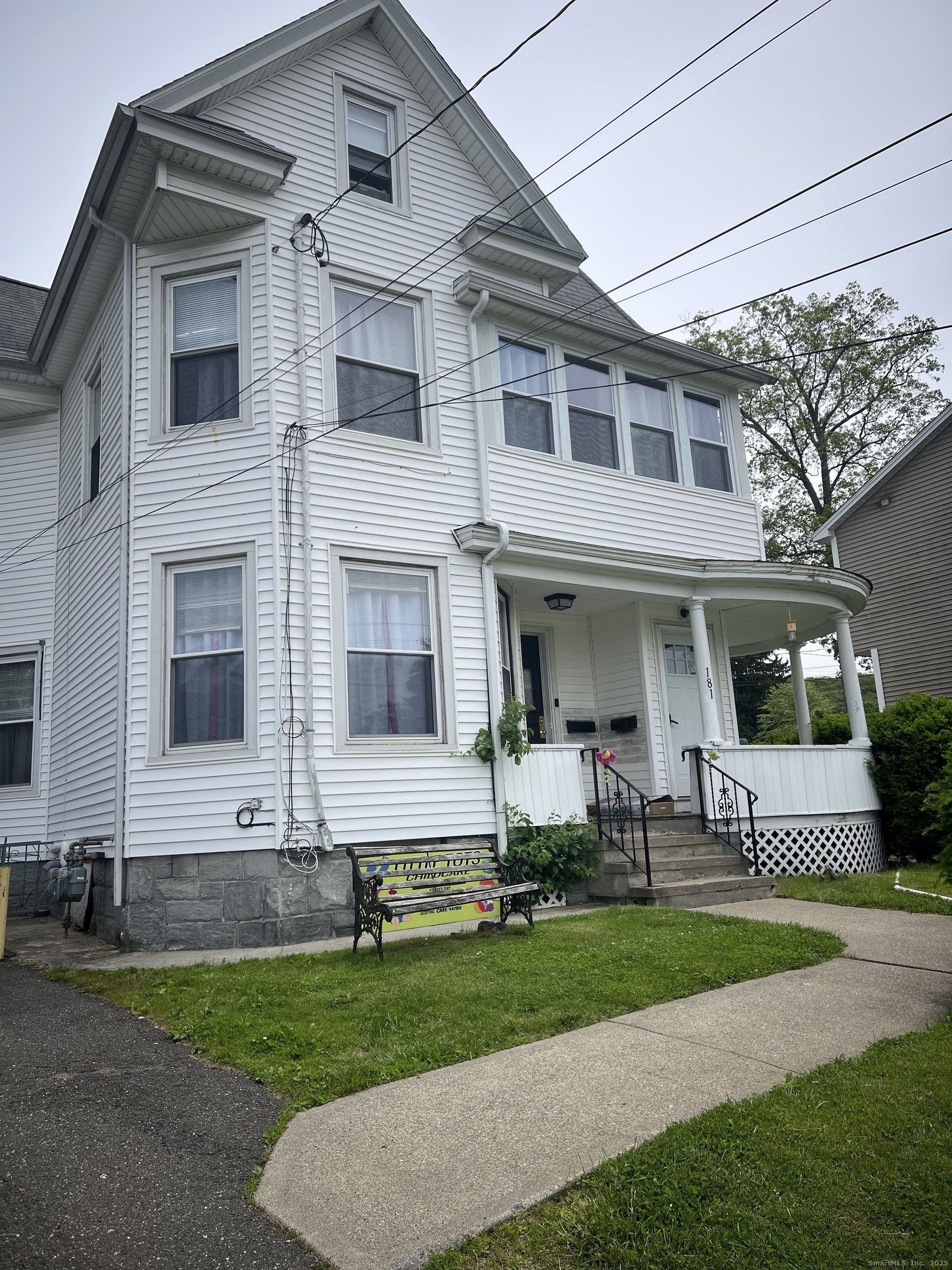 a view of a brick house with a yard