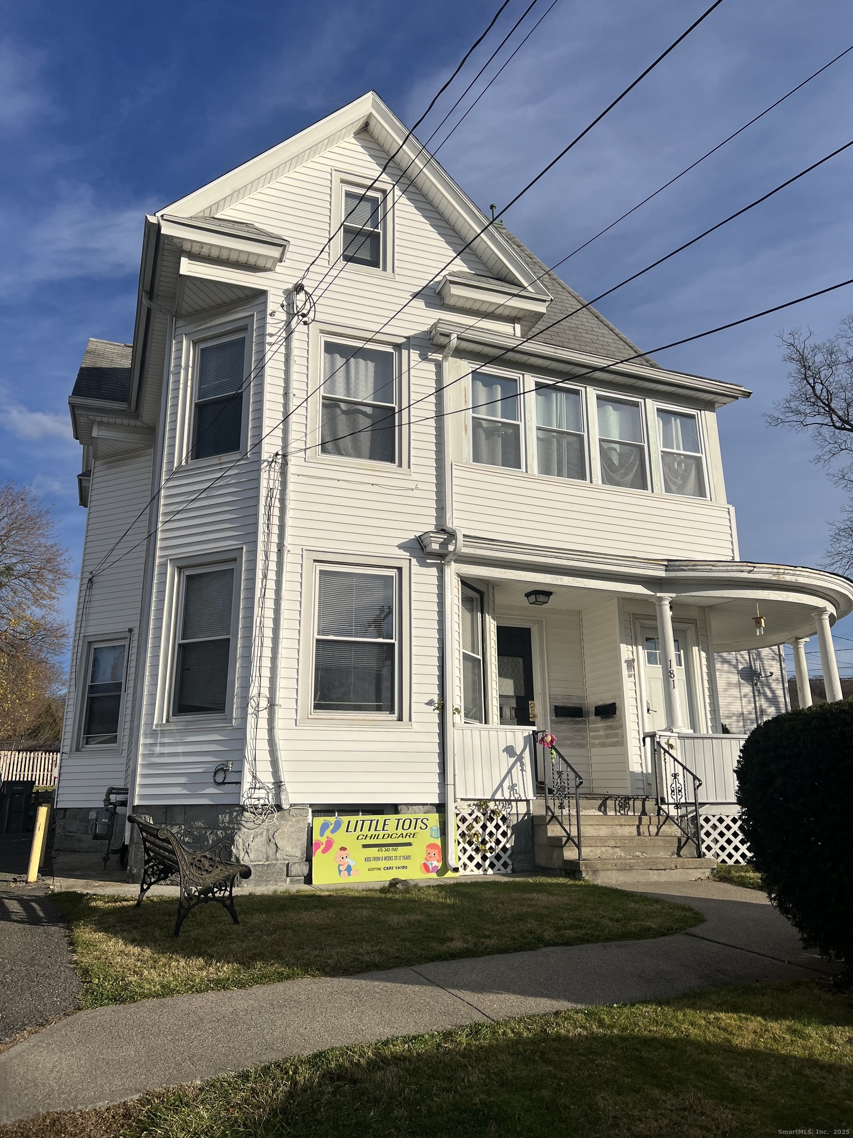 181 High Street, Unit 2 Naugatuck, CT 06770 - Photo 13 of 14 a front view of a house with a yard