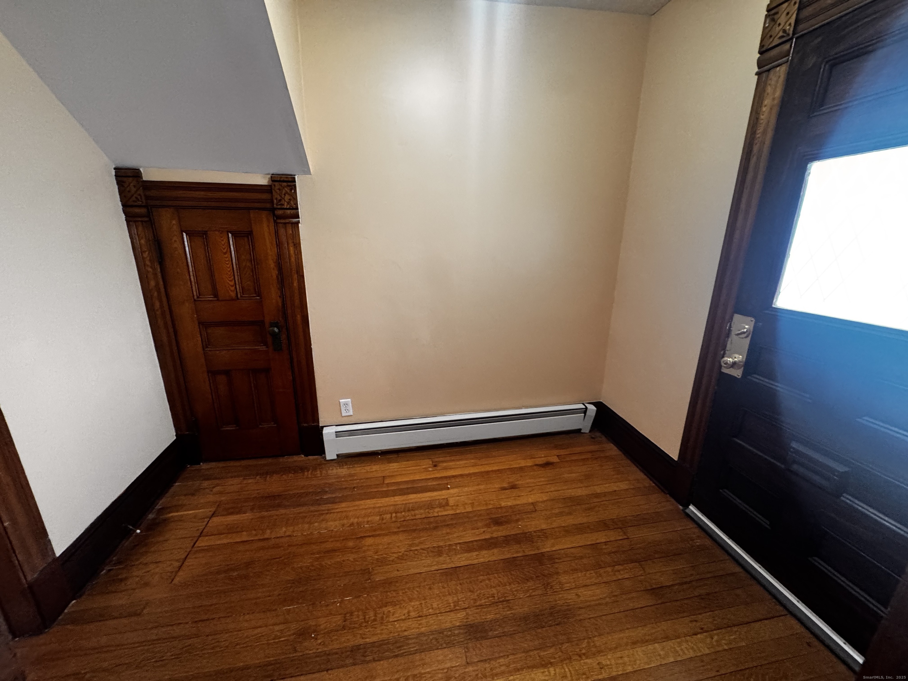 181 High Street, Unit 2 Naugatuck, CT 06770 - Photo 3 of 14 a view of an empty room with wooden floor