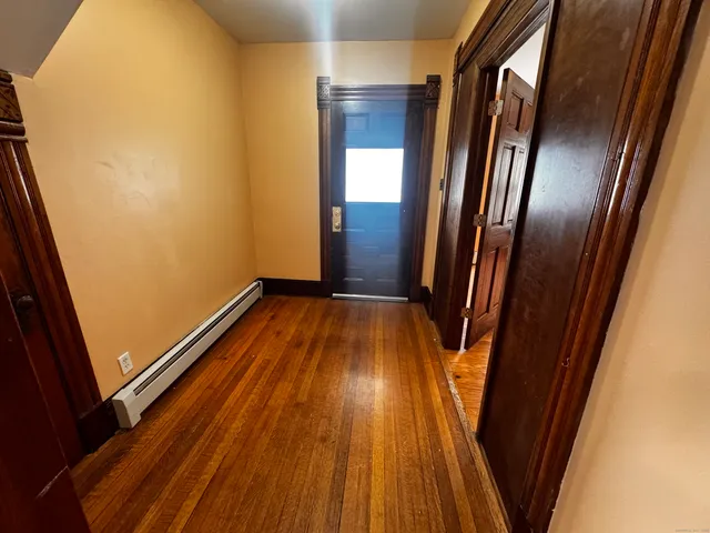 a view of outdoor space with wooden floor