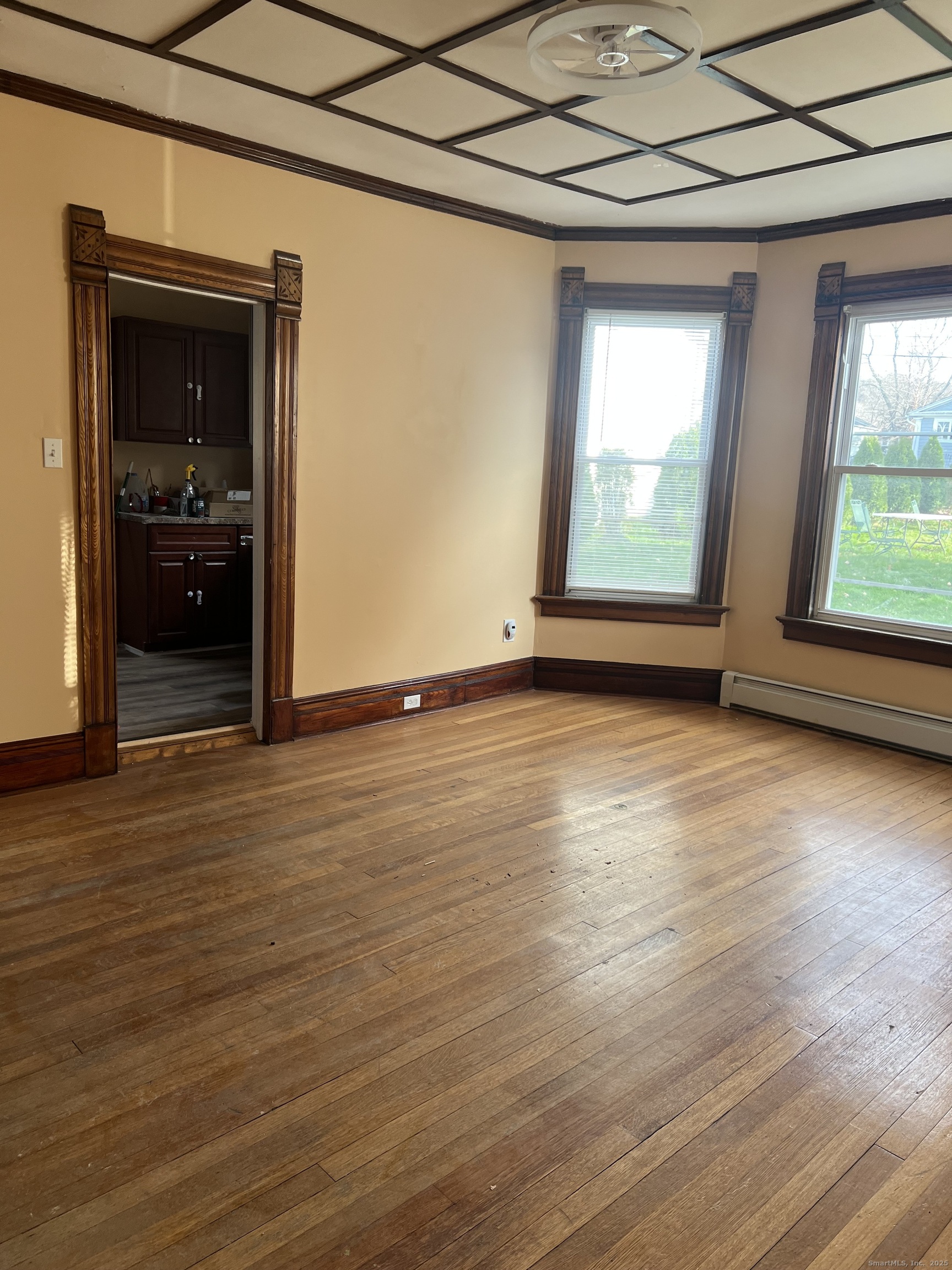 181 High Street, Unit 2 Naugatuck, CT 06770 - Photo 7 of 14 an empty room with wooden floor and windows