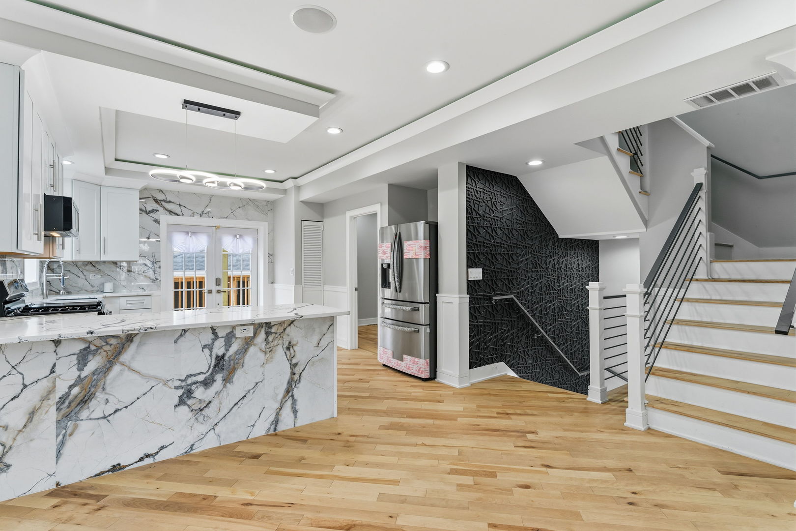 9410 South Champlain Avenue Chicago, IL 60619 - Photo 12 of 35 a view of a kitchen with wooden floor and staircase
