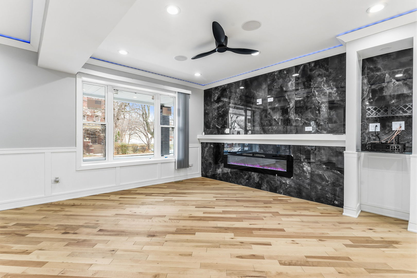 9410 South Champlain Avenue Chicago, IL 60619 - Photo 2 of 35 a bedroom with a bed and a large window