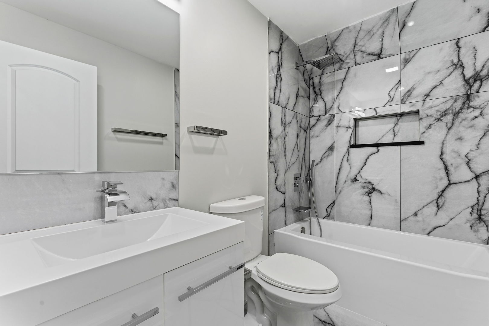 9410 South Champlain Avenue Chicago, IL 60619 - Photo 24 of 35 a bathroom with a sink toilet and shower